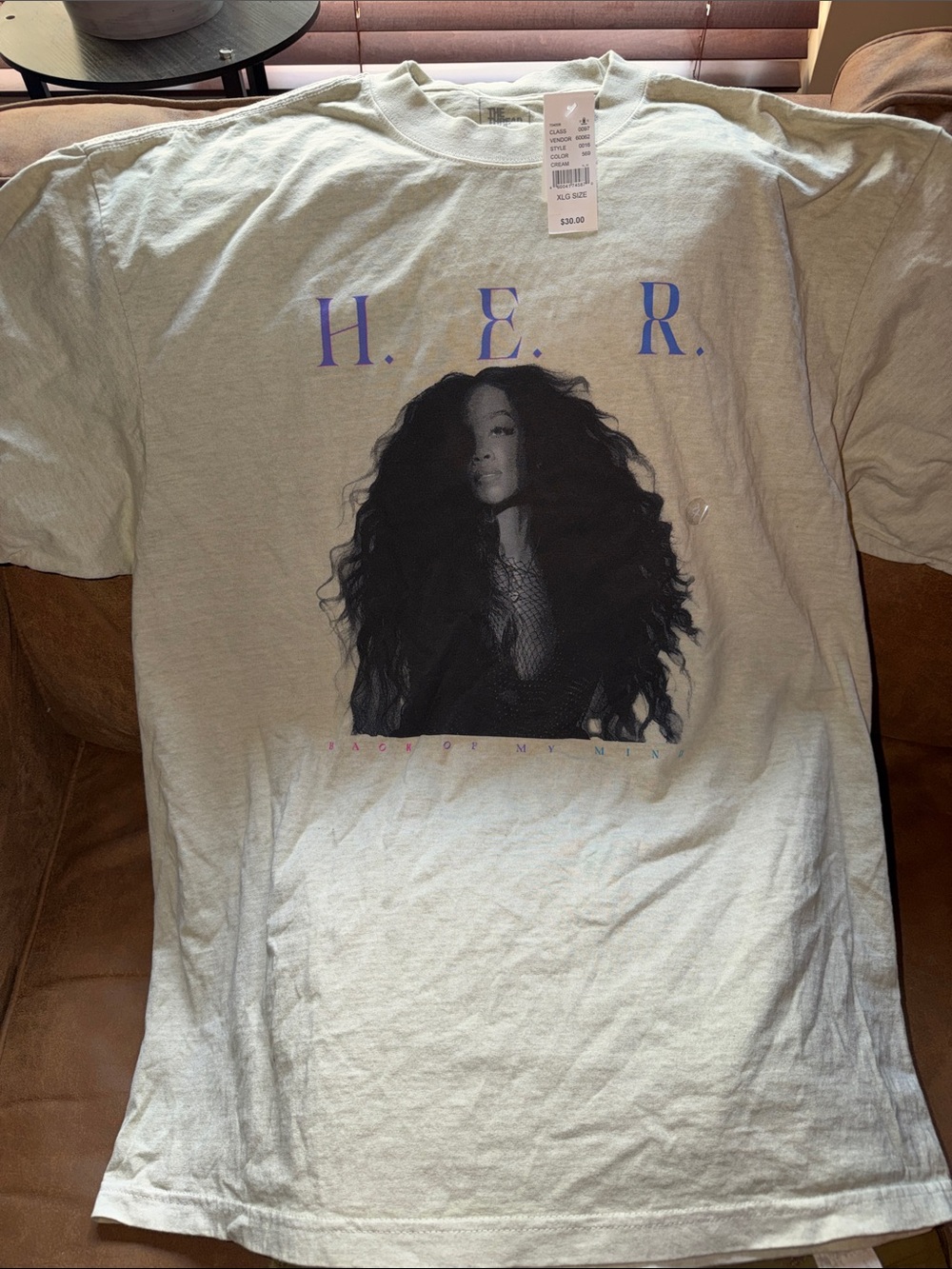 The Hundreds White Tee with Black Hair Portrait and Purple Lettering